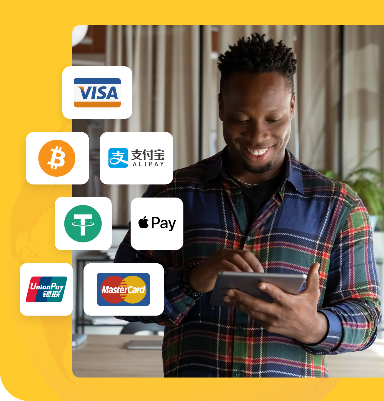 young man smiling while using his tablet with payment brand logos shown such as visa, paypal, alipay, apple pay, and union pay